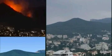Дим над гірським схилом уночі в Криму