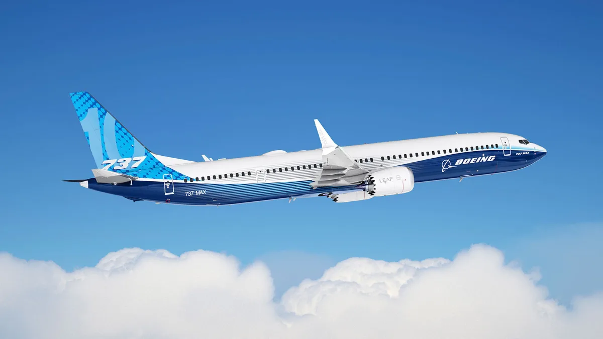 Салон літака 737 MAX 10 з рядами крісел